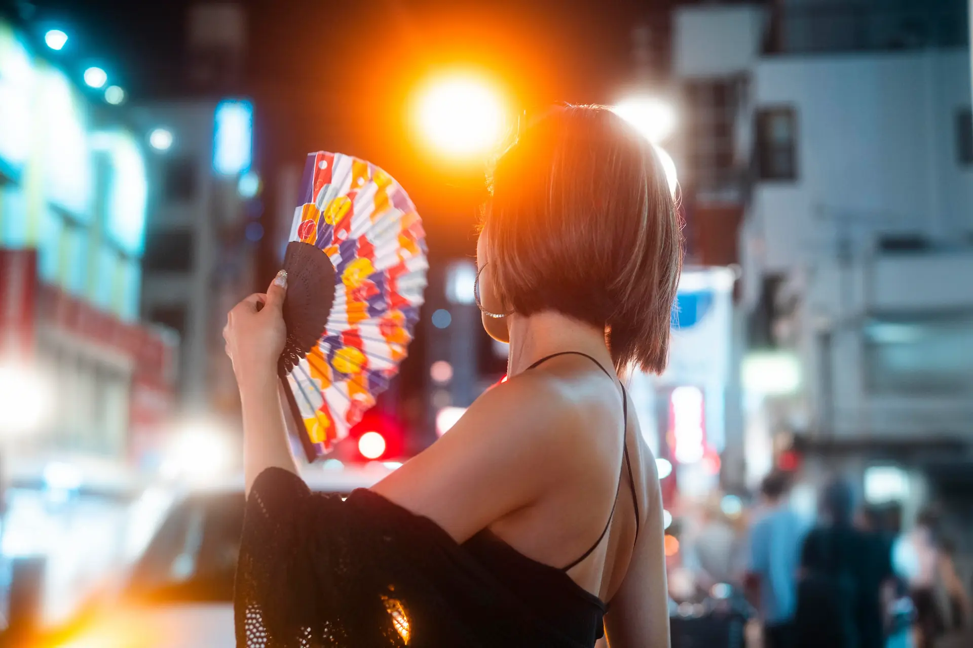 Young woman exploring vibrant nightlife in Tokyo, symbolizing the dynamic Japanese Adult Toy Market.