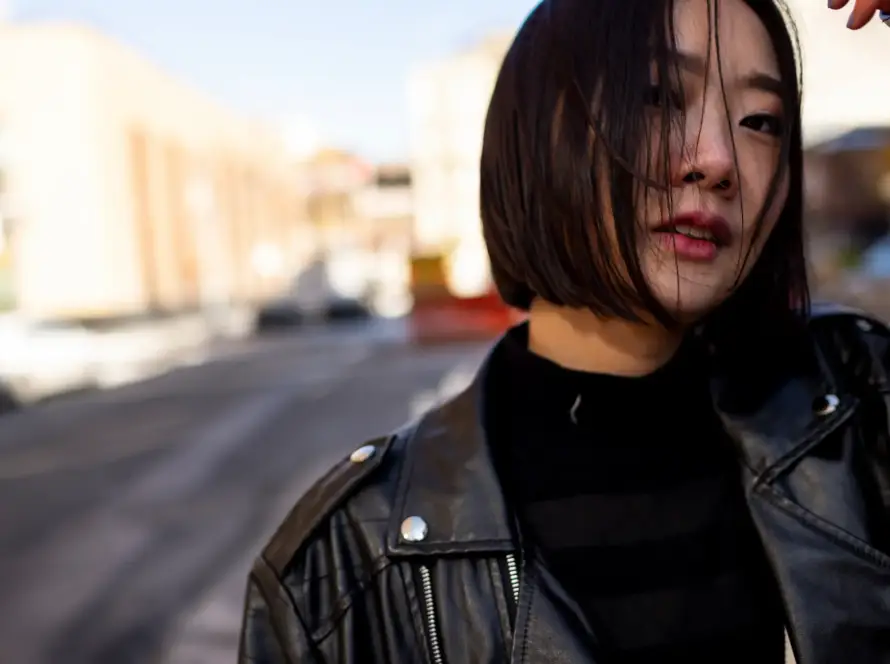 Confident Japanese woman in urban setting representing the Japan women sex toys market
