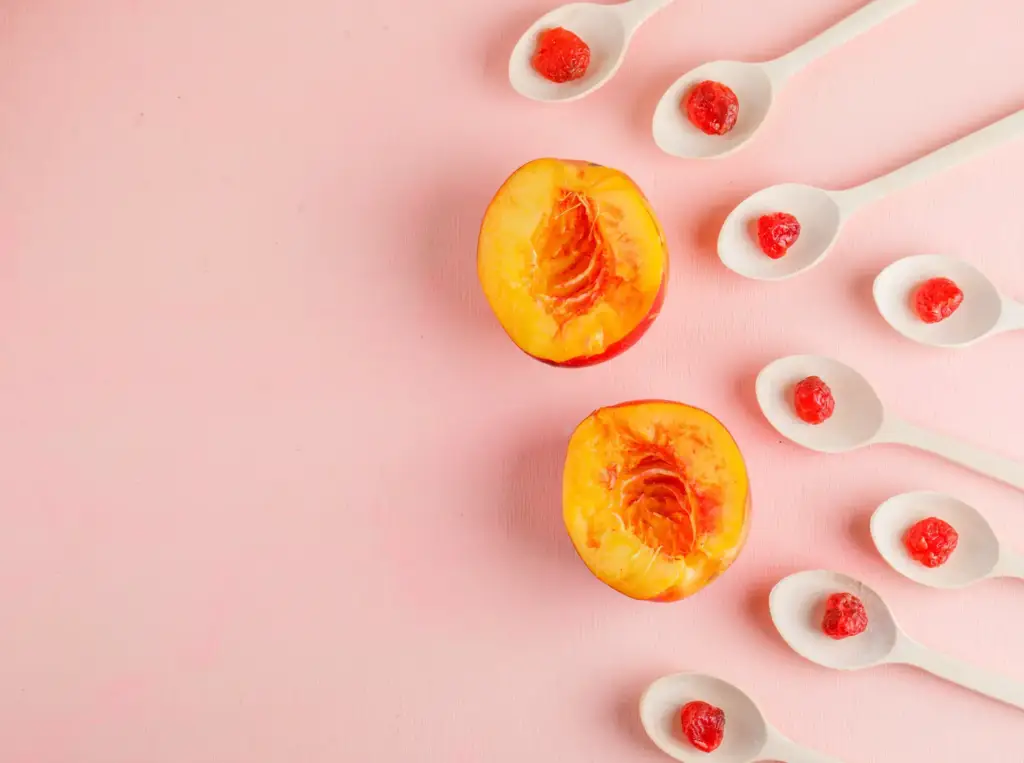 A visually artistic arrangement of sliced nectarines and cherries