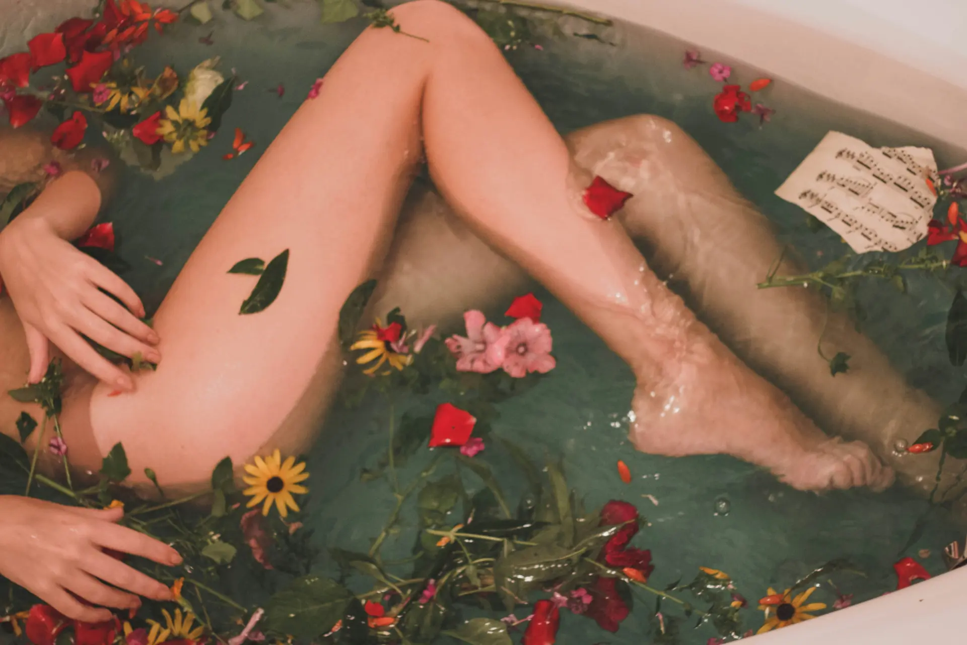 A woman relaxing in a floral bath, symbolizing wellness and discretion in Japan sex toy regulations
