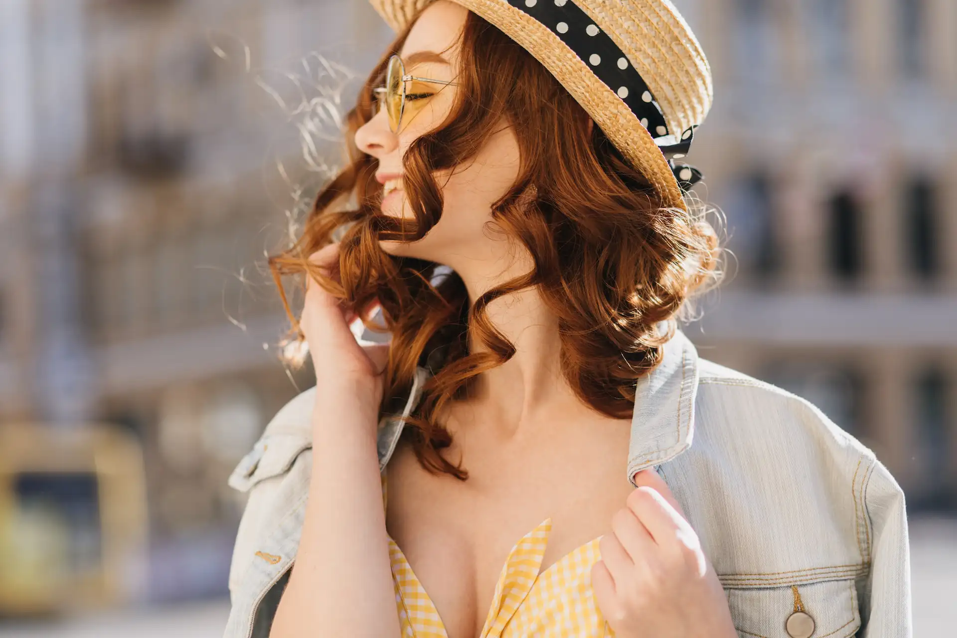 A cheerful woman with red hair in a stylish hat enjoying the outdoors. Perfect representation of confidence and empowerment, aligned with Gaia in Love's mission to support sellers to sell sex toys on Amazon Japan, .