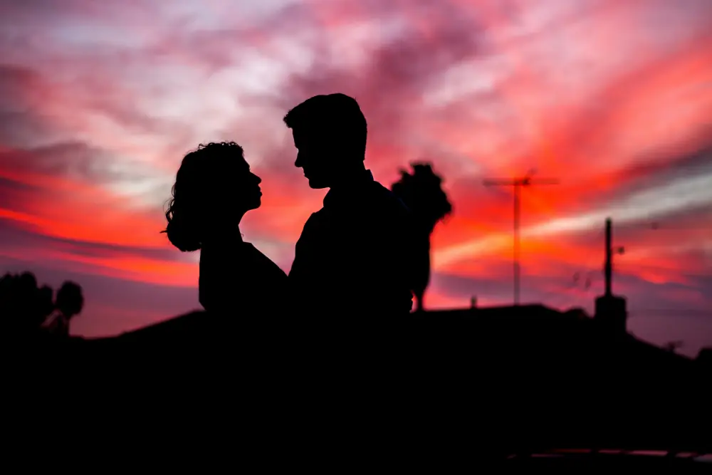 Romantic couple silhouette at sunset