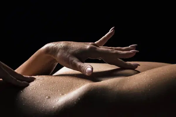 Sensual hand caressing skin