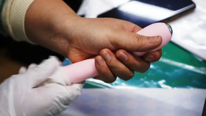 Worker at Gaia in Love, a leading adult toys manufacturer, assembling an endoscopic vibrator with precision and care