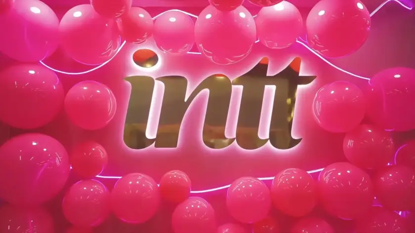 A bold and vibrant pink display at Intimi Expo 2024, featuring the illuminated Intt logo, symbolizing passion, innovation, and empowerment in the adult industry. A perfect representation of the energy at Latin America’s leading B2B adult trade show.