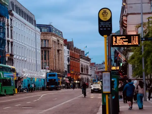 Evening street scene in Dublin city centre with buses and shops – Gaia Sex Tech B2B sex toy manufacturer in Ireland