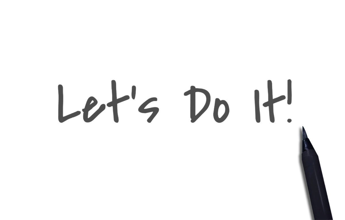 “Let’s Do It!” handwritten text on a black background with a marker pen tip