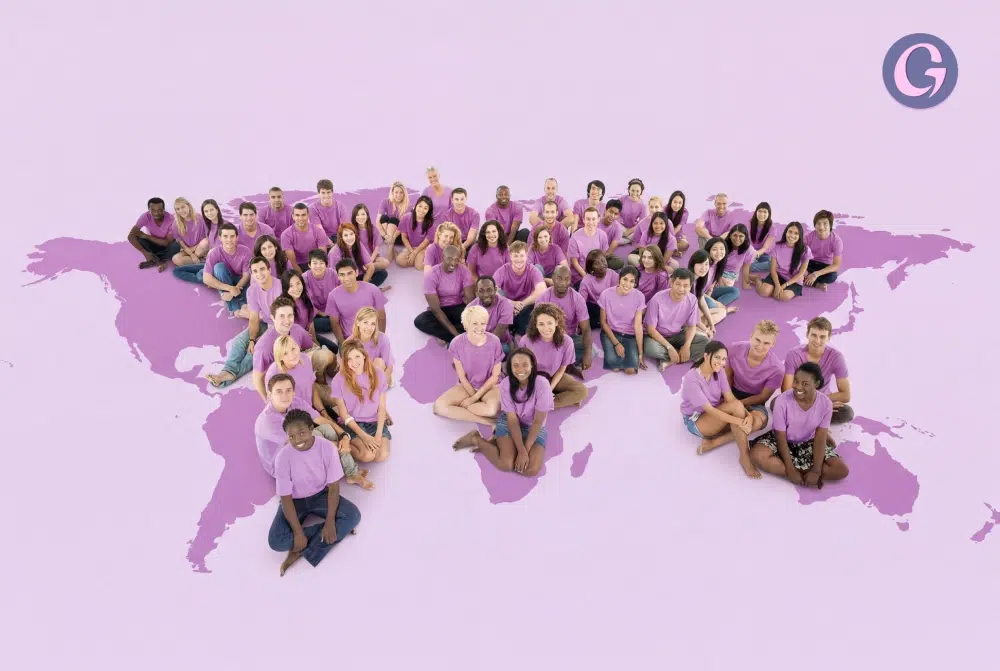 Diverse team in purple shirts seated across a world map, representing Gaia’s global sales network.